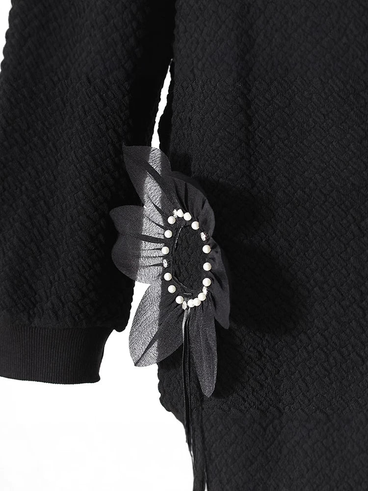 Pull à perles florales