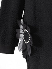Pull à perles florales