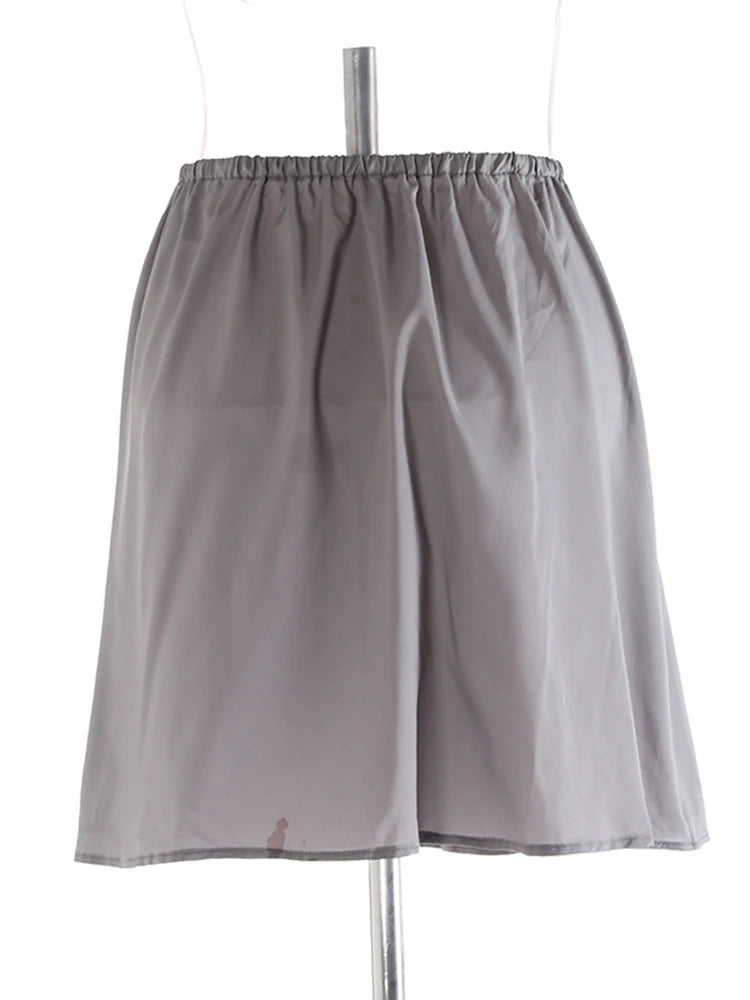 Jupe midi à volants rose gris
